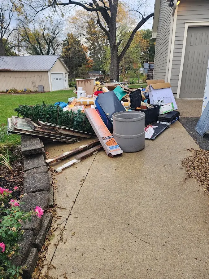 Dumpster being loaded with debris for Demolition Dumpster Rental in Monmouth